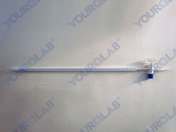 Burette with blue line on milk white background straight glass stopcock