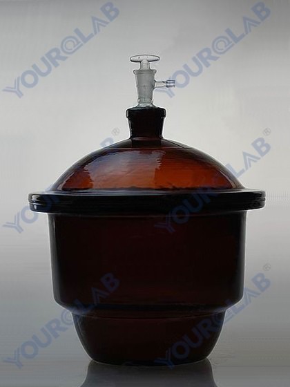 VACUUM DESICCATOR with ground-in stopcock and porcelain plate,amber glass